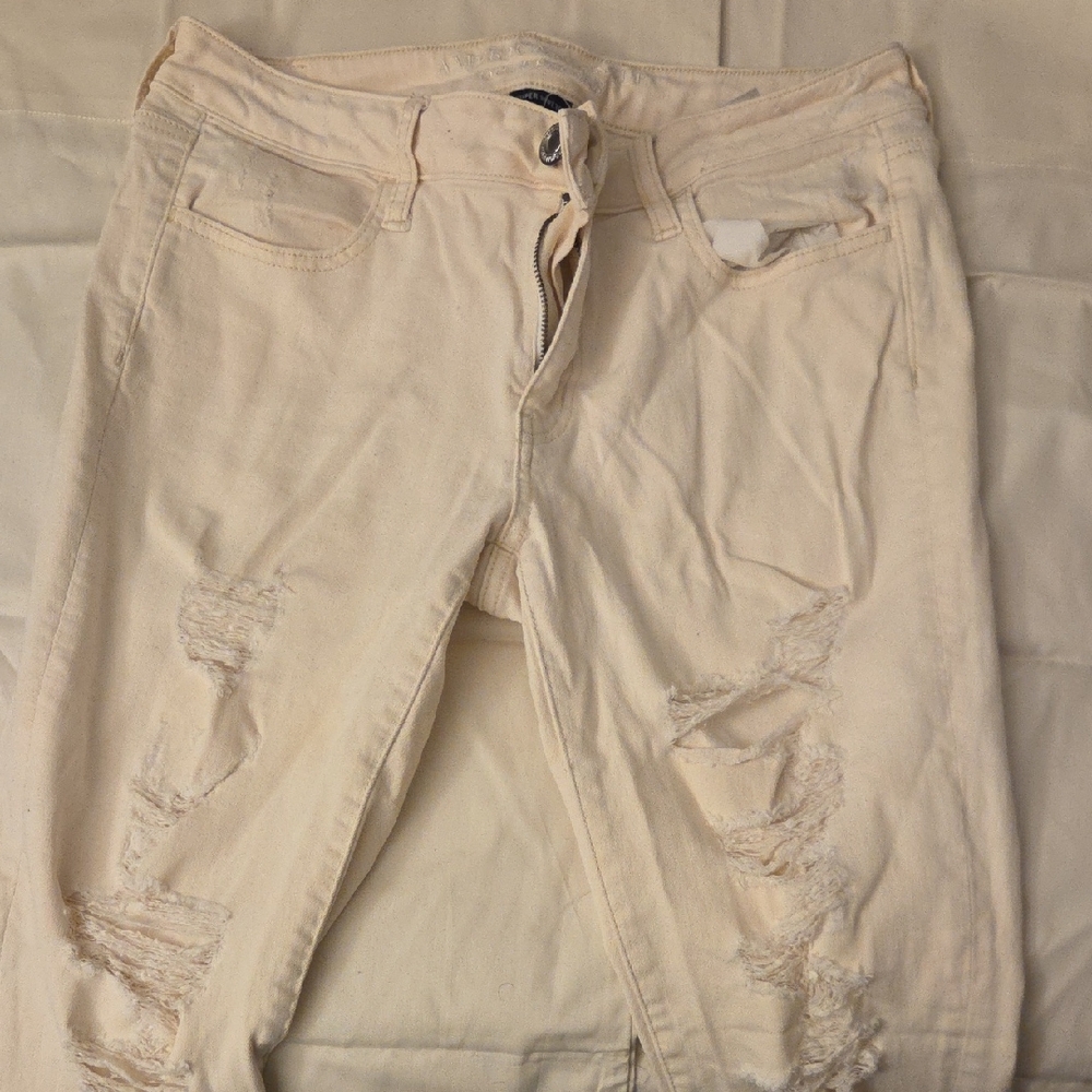 American Eagle Outfitters Cream Distressed Skinny Jeans